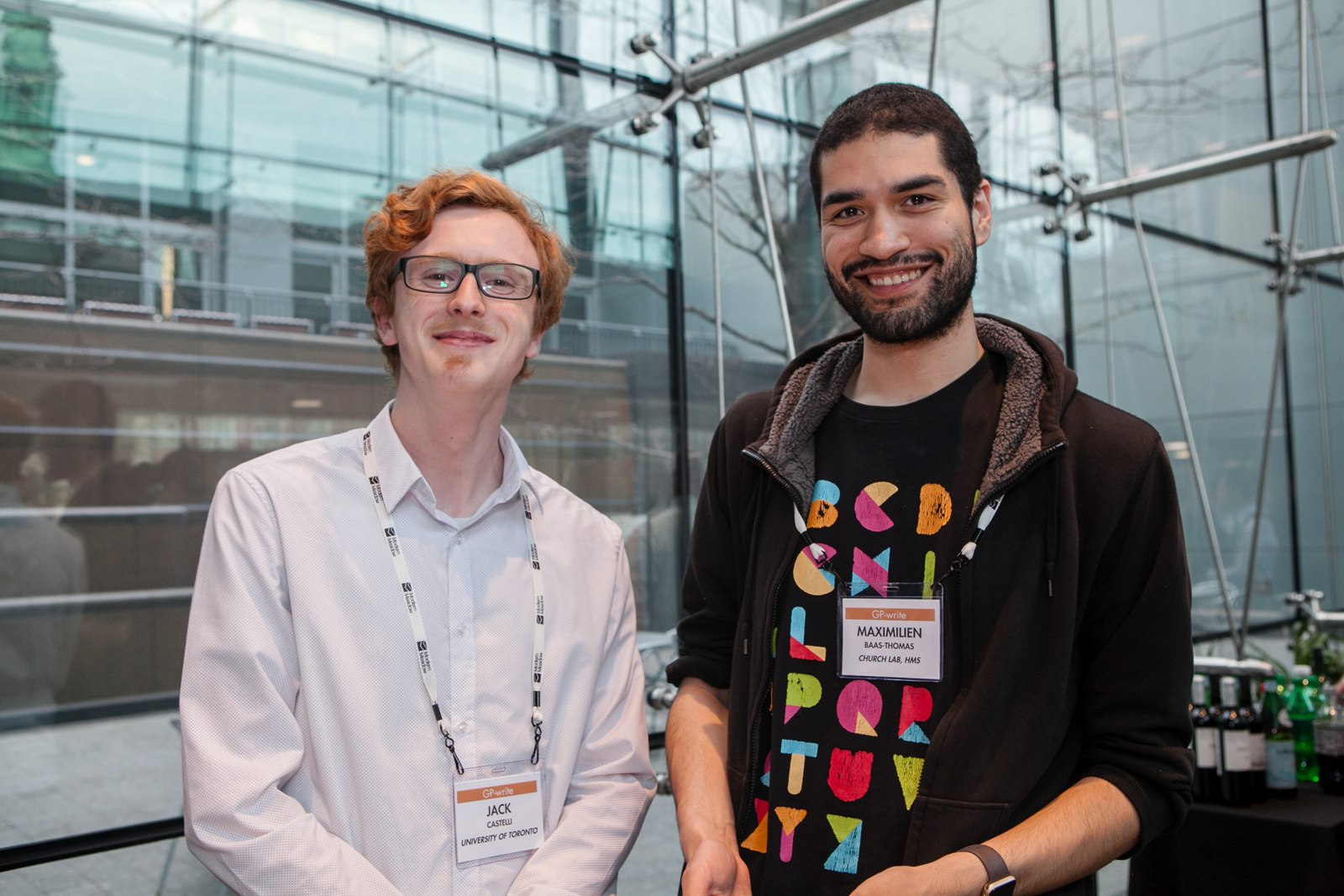 Two participants smiling together at the 2018 GP-write meeting